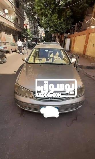 سيارة نيسان للبيع لونها دهبى فى حدايق الاهرام بالجيزة